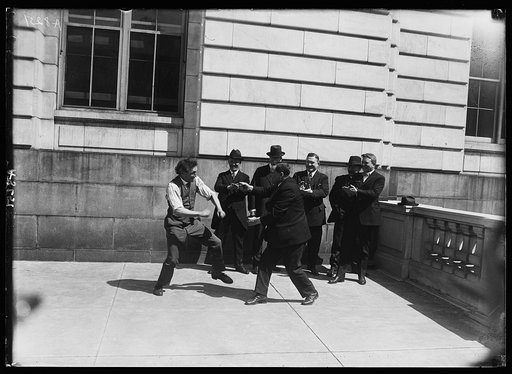 Bernarr MacFadden, famous physical culture expert of N.Y. and Sen. Smith W. Brookhart of Iowa, staged a boxing match outside Sen. office bldg.