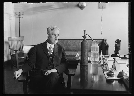 Col. M.A. DeLaney, U.S.A., the man who has been treating Pres. Coolidge on May 22nd while the Pres. was in the air-tight room receiving the chlorine gas treatment for his cold. Col. DeLaney is watching the apparatus that denotes the amount of gas being sent into the air-tight chamber