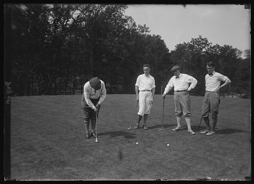 Secy. Wallace playing golf with three news-papermen