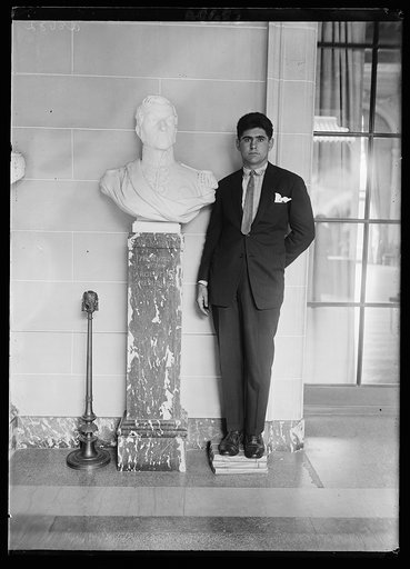 Louis Angel Firpo with the bust of Sam Martin one of the national heroes of the Republic of Argentina