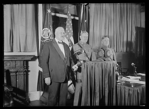 John W. Weeks, left, John J. Pershing, center