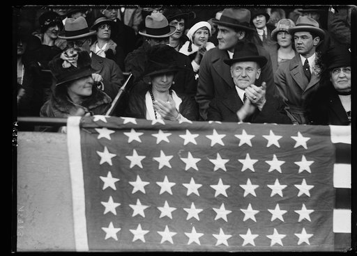 President and Mrs. Coolidge in stands