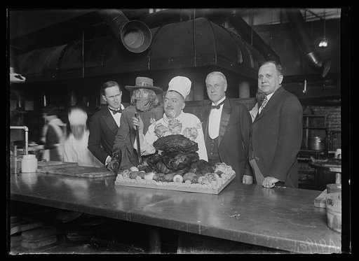 Real buffalo meat for banquet. Stephen T. Mather, Director of the National Parks entertained the newspapermen who made the tour through Yellowstone National Park with the late President Harding at a banquet in the new Willard Hotel, Dec. 10th. The above picture was made in the new Willard kitchen ju