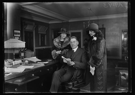 Curtis D. Wilbur, center