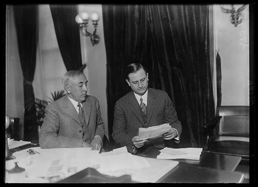 C. Bascom Slemp and Everett Sanders at desk