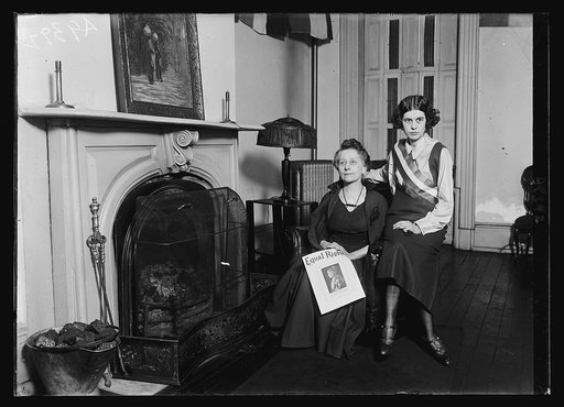 Two women, probably suffragists or members of the National Woman's Party, with copy of Equal Rights magazine. Washington, D.C.