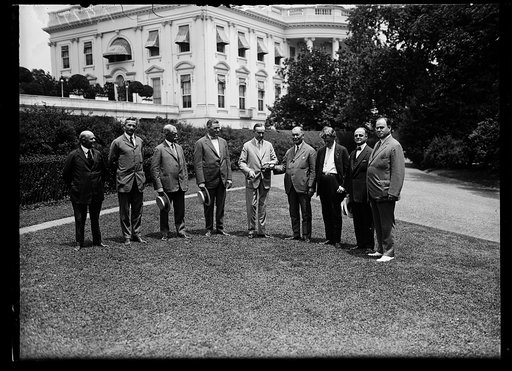 Coolidge and group outside White House, Washington, D.C.