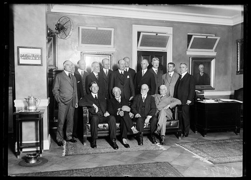 Group, includes Curtis D. Wilbur seated at left
