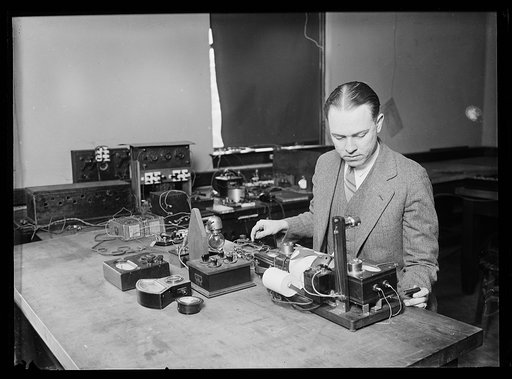 What is the wave-length of "Old Man Static," nature's most powerful broadcasting station? This photographed [sic] shows E.B. Judson of the Bureau of Standards and the static recorder he is using to run down the pranks of static and also to determine on what wave lengths this trouble-maker to radio r