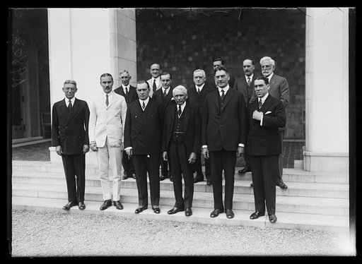Group; includes Frank Kellogg, center front, and Curtis D. Wilbur, 2nd from right, front