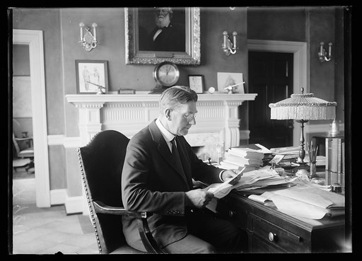 Curtis D. Wilbur at desk