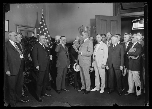 Group at swearing in; includes Harry S. New, center left, and Hubert Work, center right