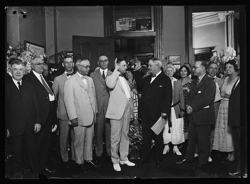 Group at swearing in; includes Hubert Work, center left, and Harry S. New, center right