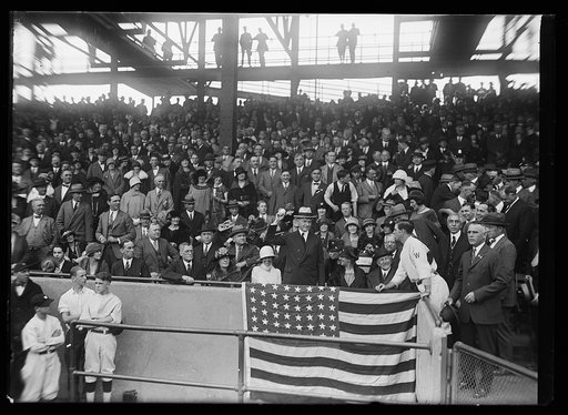 Pres. Coolidge throws out the ball that starts the World Series at Wash. between the Nationals and the Giants. In the box with the Pres.: Mrs. Coolidge, Speaker and Mrs. Gillette; Stanley Harris, Mgr. of the Wash. team standing at right of the President's box