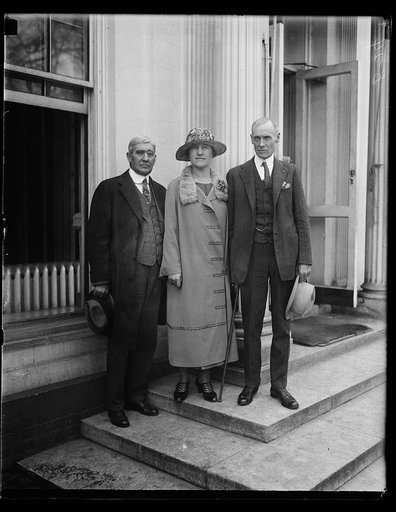 Callers at the White House. State Senator J. Monroe Fitch from Muncie, Indiana (right) with Mrs. Fitch, who was the Women's State Manager for Indiana in the latest Coolidge campaign, were callers at the White House today, April 10th. They were introduced to President Coolidge by Cong. Vestal of Indi