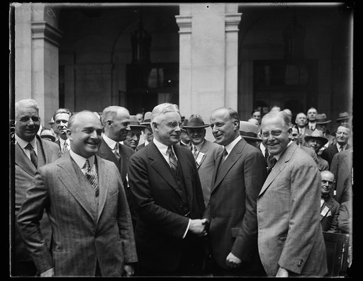 The Governor of Maryland, Albert Ritchie, was the principal speaker at today's session of the annual meeting of the United States Chamber of Commerce in Washington. In this photograph the governor is being welcomed by John O'Leary, (right) President of the Organization. On the left is L.C. Pierson, 