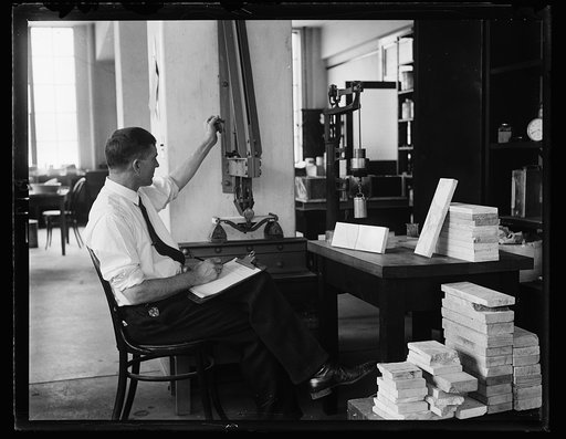 Is marble elastic, you inquire? Yes, tests that the Bureau of Standards show that a specimen of marble when subjected to great pressure stretches or gives a certain degree without breaking. This photograph shows D.W. Keesler conducting the so-called flexture test with a machine while was designed fo