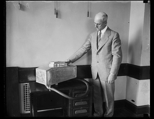False tanks used to check up gasoline filling stations. Theodore A. Seraphin, Deputy Supervisor of Weights and Measures of Philadelphia, with the false tank he displayed at the National Conference on Weights and Measures in Washington, May 26th. This tank he conceals in his car and checks up on gaso