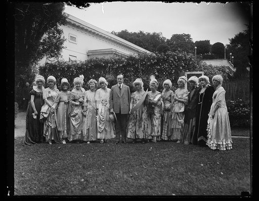 Calvin Coolidge with group in colonial dress outside White House, Washington, D.C.