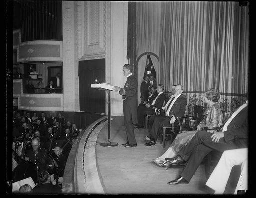 Commander Richard E. Byrd, the first man to reach the North Pole by airplane, repeating his experiences on the flight before President and Mrs. Coolidge and an audience of 6,000, including cabinet officers, members of the diplomatic corps. and representatives of National Geographic Society from whom