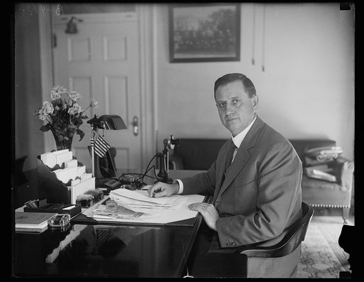 Everett Sanders at desk, Washington, D.C.