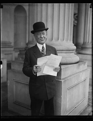Man holding Bill, H.R. 976. U.S. Capitol, Washington, D.C.