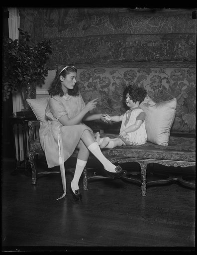 Miss Suzette Dewey, daughter of the Assistant Secretary of the Treasury and doll to be sold at Children's Home ball at the Mayflower