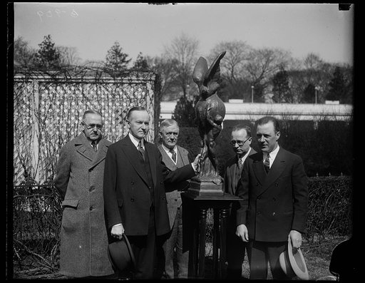 Calvin Coolidge and Harry S. New and group with statue outside White House, Washington, D.C.
