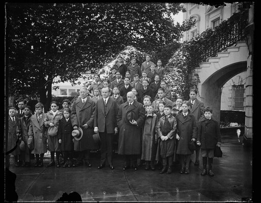 Calvin Coolidge and group of boys outside White House, Washington, D.C.