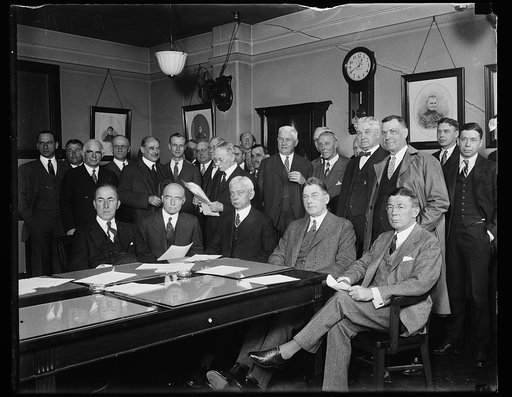 Group; Curtis Wilbur at head of table