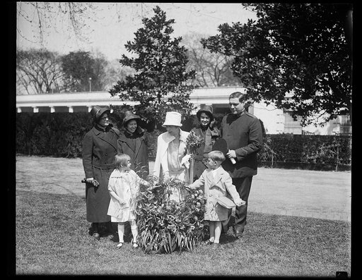 Salvation Army children of California send Mrs. Coolidge a gift of flowers by airplane. A beautiful basket of flowers sent by airplane by the children of the Salvation Army Home at Lytton Springs, California, was presented to Mrs. Coolidge at the White House today. Ketha Holtz, daughter of Staff-Cap