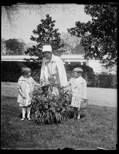 Salvation Army children of California send Mrs. Coolidge a gift of flowers by airplane. A beautiful basket of flowers sent by airplane by the children of the Salvation Army Home at Lytton Springs, California, was presented to Mrs. Coolidge at the White House today. Ketha Holtz, daughter of Staff-Cap