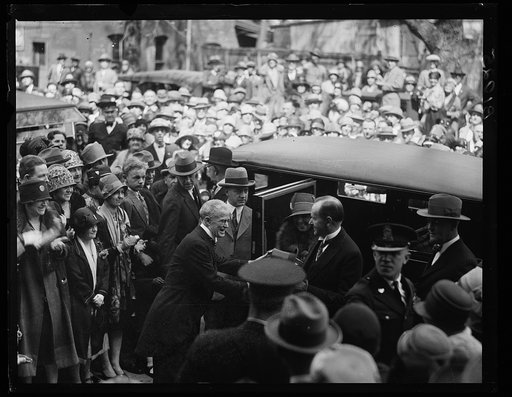 President Coolidge and Mrs. Coolidge exiting automobile