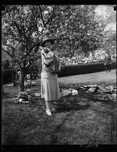 Grace Coolidge holding pet raccoon "Rebecca"