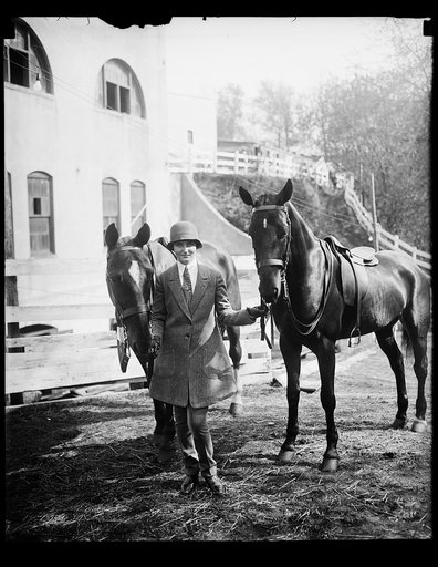 In spotlight at opening of Washington Horse Show. Mary Parker Corning, daughter of Representative and Mrs. Parker [...]rning of New York, with "Red" and "Joy", her favorite thoroughbreds at the opening of the Washington Horse Show today