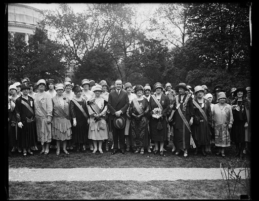 President greets Daughters of 1812. Members of the Daughters of 1812 who are holding their annual convention in Washington, were received by President Coolidge at the White House today. In the center of photograph, left to right: Mrs. Samuel Preston Davis, of Little Rock, Ark., President General; Pr