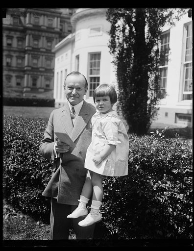 Youngster presents President Coolidge with check for flood victims and first "Buddy Poppy" for Veterans of Foreign Wars. Today was a happy one for little Elizabeth Anne Stitt, three-year-old daughter of Commander-in-Chief of the Veterans of Foreign Wars, for she had the honor of presenting President