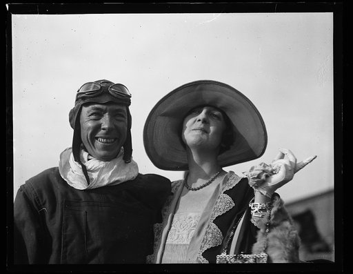 Lt. Charles McK. Robinson, is greeted by Mrs. Arthur B. McDaniel, wife of Capt. McDaniel, who flew with Lt Robinson on the San Tonio on the historic Pan American flight