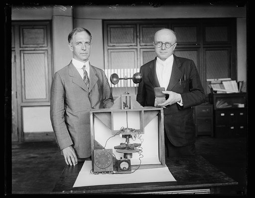 Scientists for Uncle Sam awarded Magellan Gold Medal. Dr. L.J. Briggs, left, Assistant Director and Dr. Paul R. [Heyl?], Chief of the Sound Section of the United States Bureau of Standards, with the first successful experimental model of the earth inductor compass, which they developed for the Army 