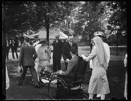 Calvin Coolidge greets wounded man
