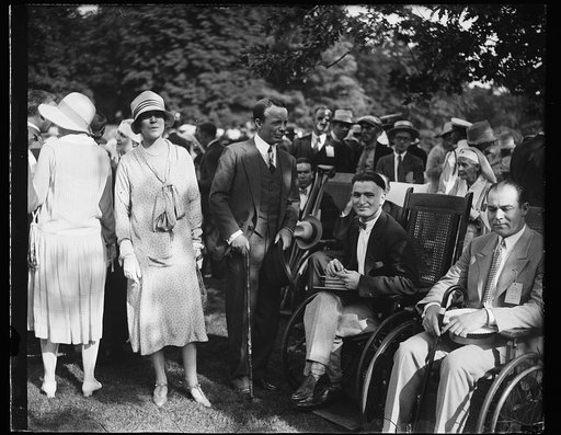 Alice Roosevelt Longworth and Theodore Roosevelt, Jr. with men in wheelchairs