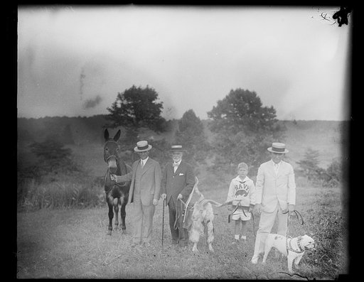 Group; includes boy with Navy goat?