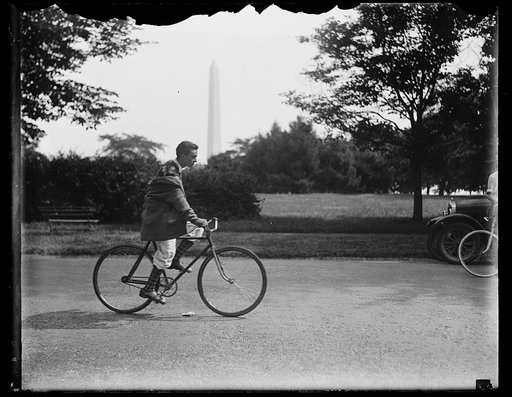 Bicycle rider;Washington Monument in background, Washington, D.C.