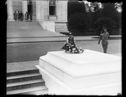 Native American placing flowers on Tomb of Unknown Soldier, Arlington National Cemetery, Arlington, Virginia