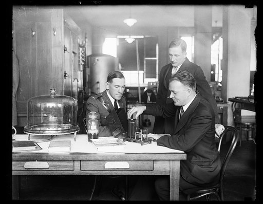 Men with device with label "aircraft barograph"
