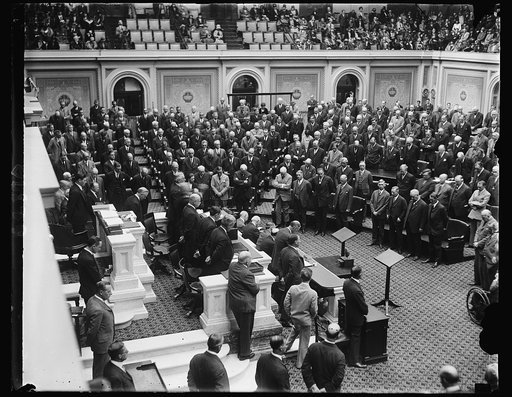 The Seventieth Congress convenes. The Seventieth Congress met at noon today ready to take up tax reduction, farm relief, flood control and many other problems of the nation. Dr. Shera Montgomery, chaplain of the House is shown delivering the opening prayer