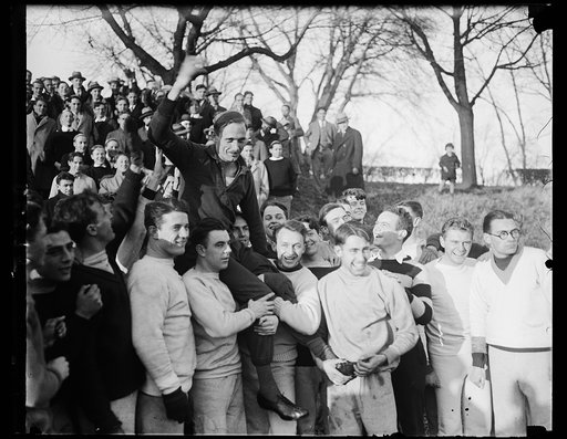 Georgetown University students give German track star a noisy welcome in Washington. Students at Georgetown University where he is a guest while in Washington gave Dr. Otto Peltzer, noted German athlete, a noisy welcome when he appeared at the athletic field for his first "workout" today since landi