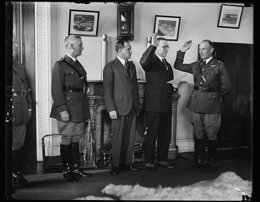 New Air Corps Chief takes oath of office. Maj. Gen. James F. Fechet being sworn in as Chief of the Army Air Corps to succeed Maj. Gen. Mason M. Patrick, retired. In the photograph, left to right; Maj. Charles P. Summerall, Chief of Staff. F. Trubee Davison, Assistant Secretary of War for Aviation; L