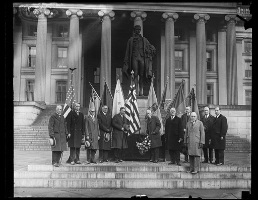 Group, including Andrew W. Mellon, center, in front of Alexander Hamilton Statue at U.S. Treasury Building, Washington, D.C.