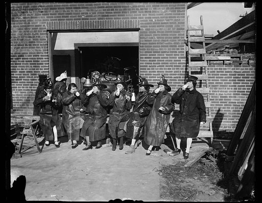 Down in Virginia where "the men are men and the women are firemen."  When a new fire house was needed for Aurora Hills and nearby territory in Arlington County Virginia, the women donned overalls and helped the men build one. This photograph was snapped as the girls stopped for lunch and also to pow